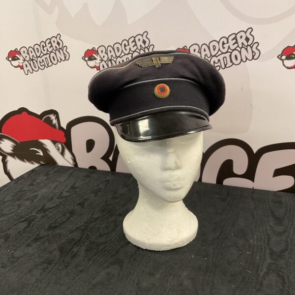 Vintage German railway cap with insignia, a collectible piece of headwear.
