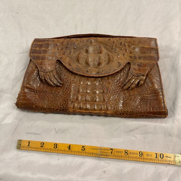 Vintage 1940s hornback alligator clutch purse, front view.