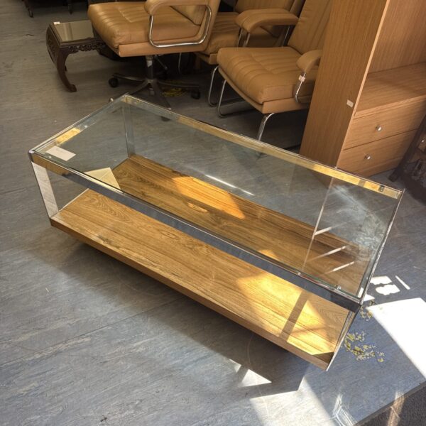 Stylish glass coffee table with chrome frame.