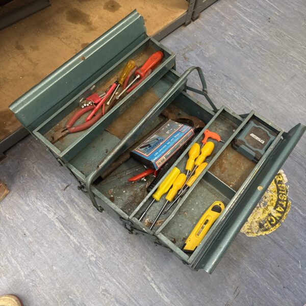 Vintage Ital cantilever toolbox filled with various tools.