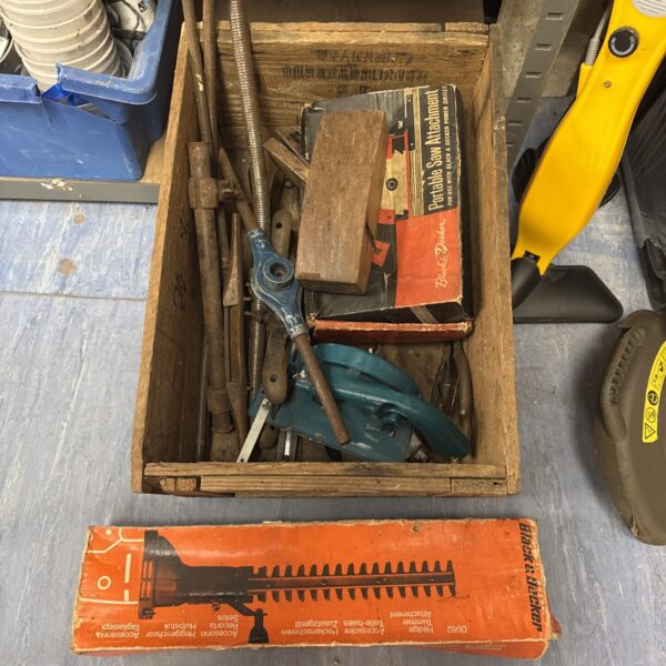 Vintage Black and Decker saw attachments in a tool lot.