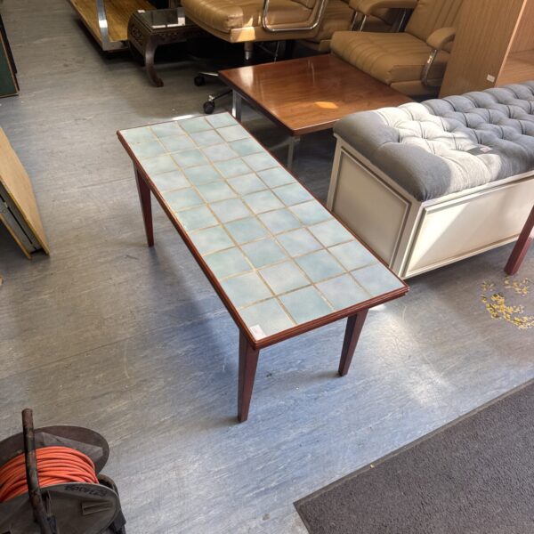 Vintage tile top coffee table with a retro mid-century modern design.