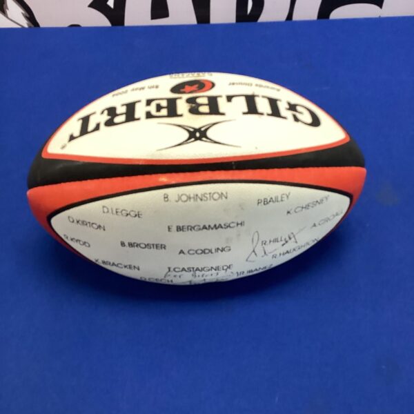 Signed England rugby ball with multiple player signatures.