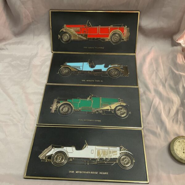 Set of four classic car wall plaques featuring Bentley, Bugatti, Lancia, and Mercedes.