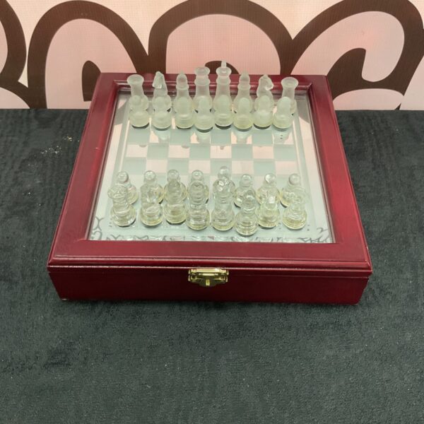 Mirrored glass travel chess set with case open.