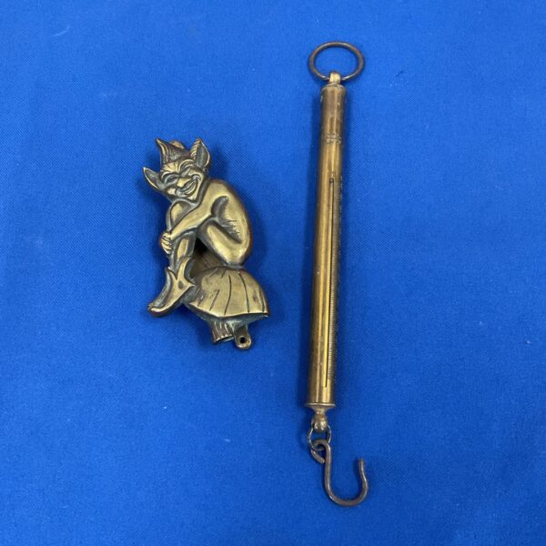 Vintage brass salter scales with a pixie figure.