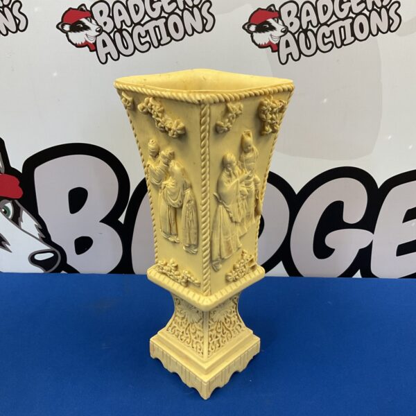 Detailed view of a 13” Japanese resin vase with intricate carvings.
