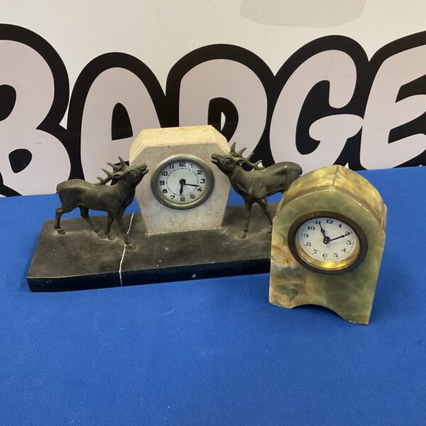 Vintage stag clock on stone base, collectible animal figurine.