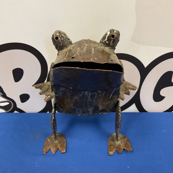 Detailed metal art frog garden ornament with textured finish.