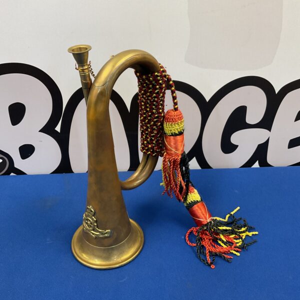 Antique Royal Artillery bugle horn with colourful tassel.