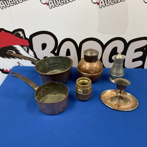 Antique copper pans and chamberstick, vintage kitchenware collection.