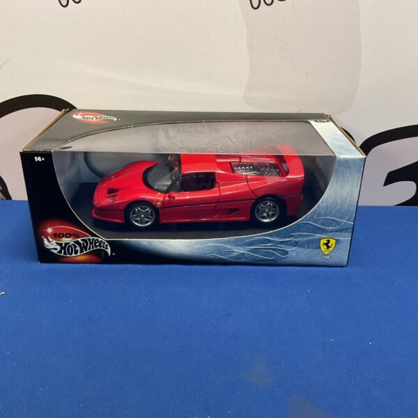 Red Hot Wheels Ferrari F50 diecast model car on display.