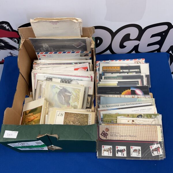 Vintage collection of first day covers and postcards for collectors.