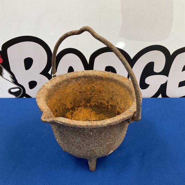 Antique cast iron glue pot with handle and feet.