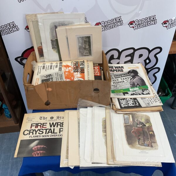 Vintage ephemera collection with old prints and magazines.