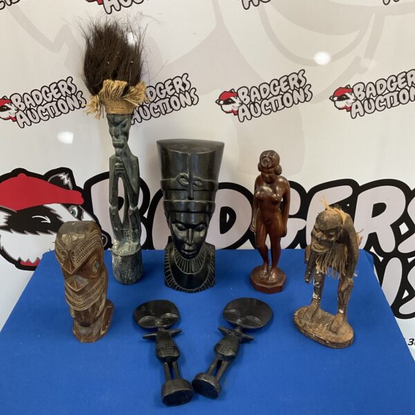 Lot of vintage African carved wood sculptures depicting human figures.