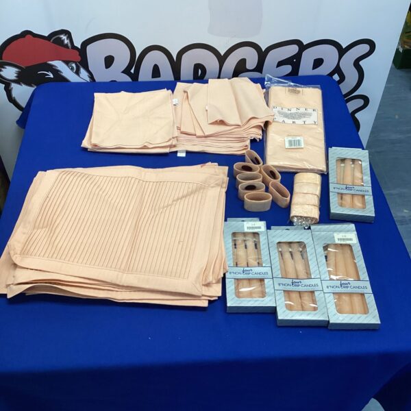 Table linens and candle set with napkin rings and placemats.