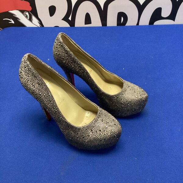 Stunning Christian Louboutin Daffodil heels covered in dark crystals.
