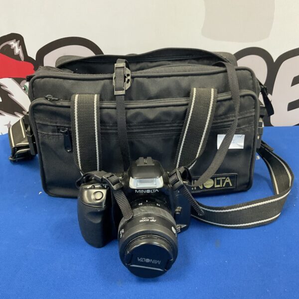 Vintage Minolta Dynax 300si camera with carrying bag.