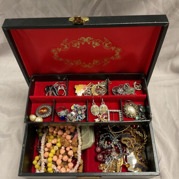 Vintage Philipp Sweden jewellery box filled with colourful costume jewellery.