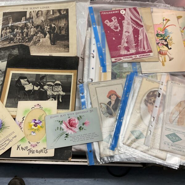 Edwardian scrapbook ephemera collection with vintage theatre programmes and cards.