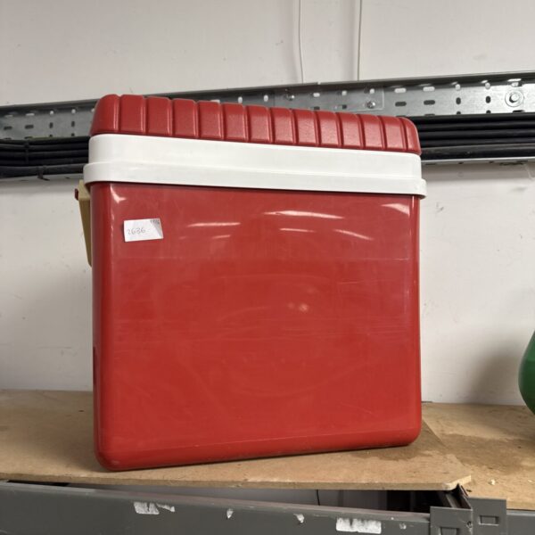 Red insulated cool box for picnics and outdoor events.