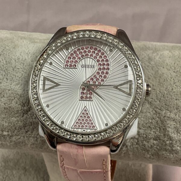Stylish Guess ladies’ quartz wristwatch with pink leather strap.