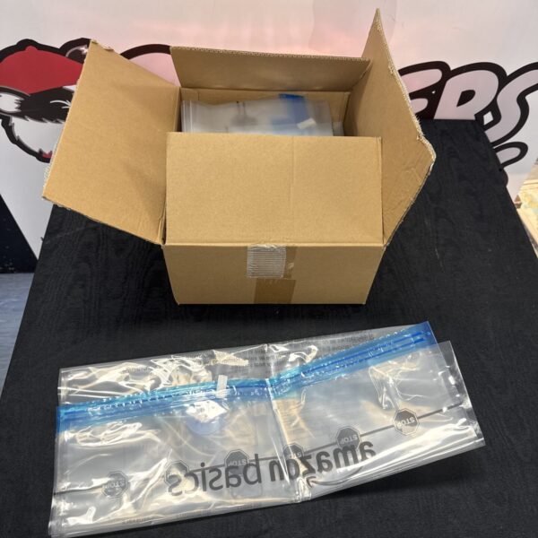 Stack of Amazon Basics vacuum storage bags for clothing and bedding.