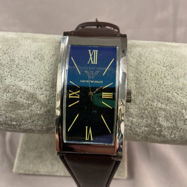 Stylish Emporio Armani wristwatch with a blue dial and stainless steel bracelet.