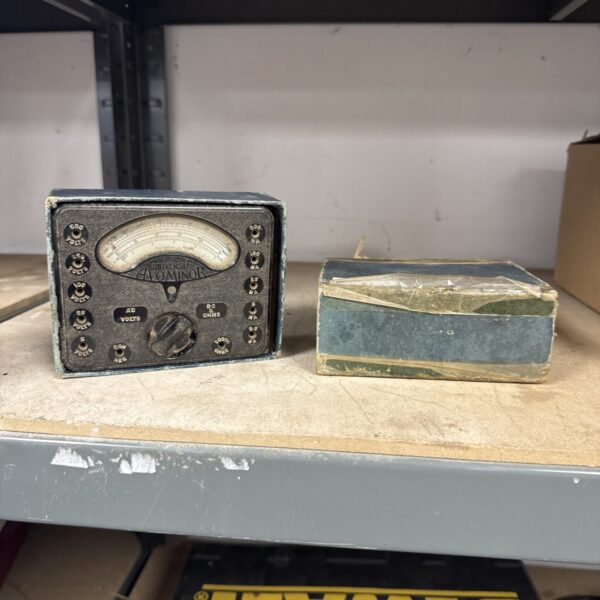 Vintage Avominor Model 8 test meter, a classic electrical testing instrument.