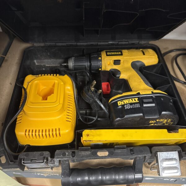 Vintage Dewalt DW997 cordless drill with charger and battery.