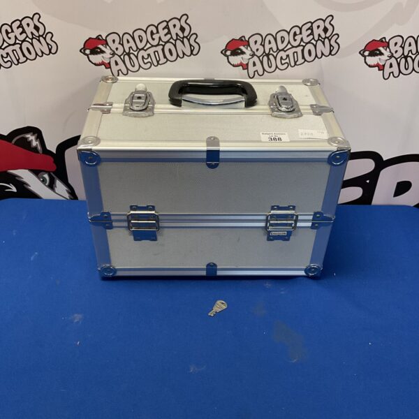 Silver aluminium storage box with key lock, front view.