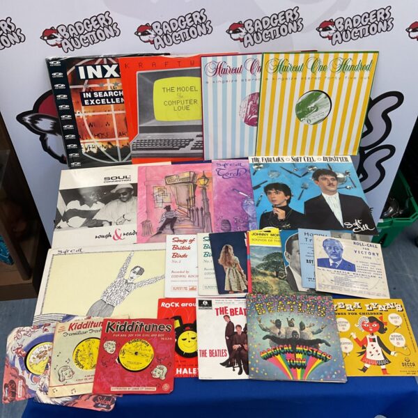 Mixed lot of vinyl records including INXS, Soft Cell, and The Beatles.
