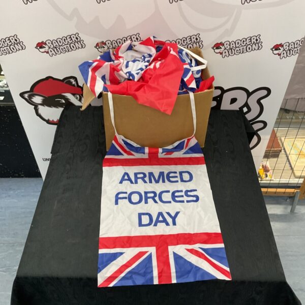 Box of Armed Forces Day bunting with Union Jack flags.