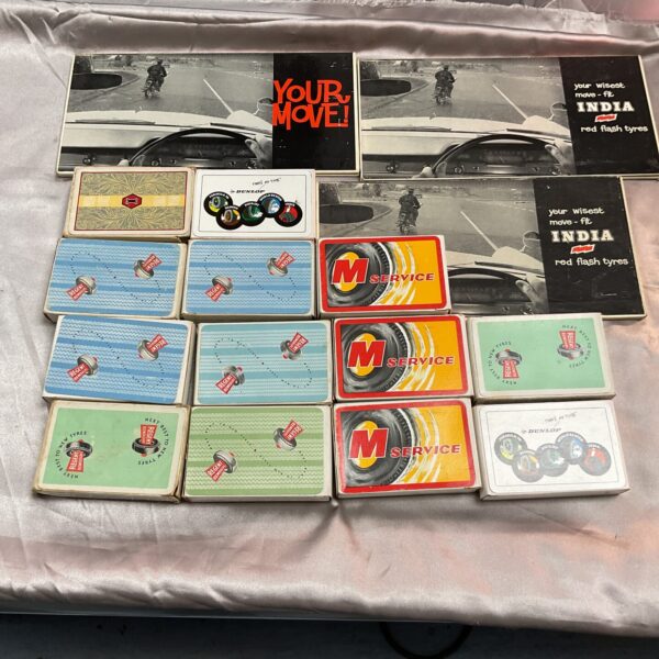 Vintage Dunlop tyre advertising signs and playing cards collection.
