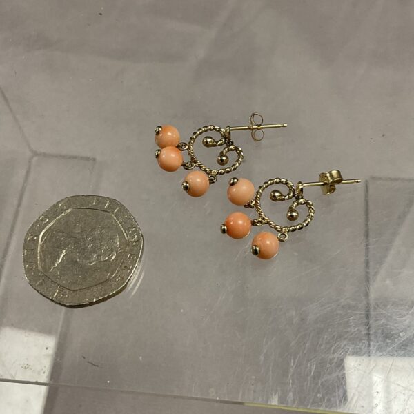 Vintage 9ct gold coral earrings, classic stud design.