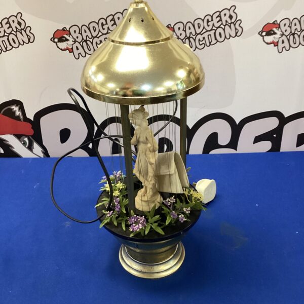 Vintage lady oil lamp with frosted glass shade.