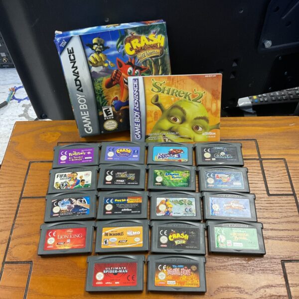 Game Boy Advance games lot featuring Crash Bandicoot and Spiderman cartridges.