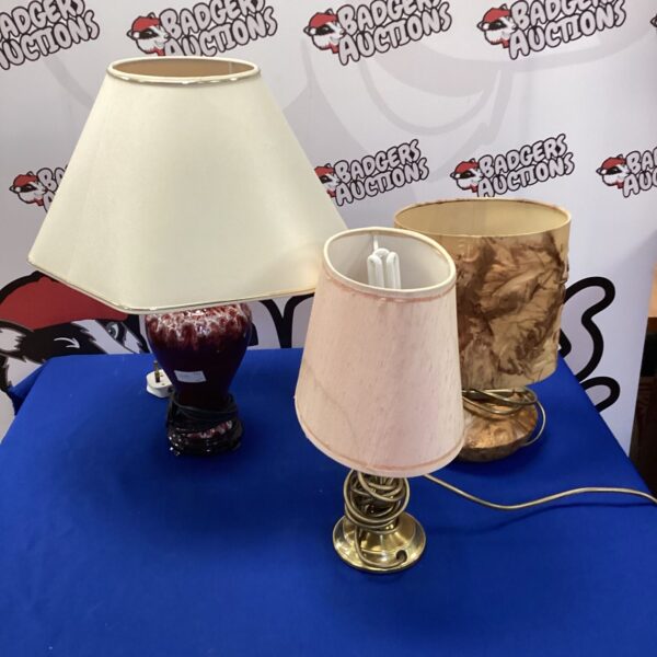 Vintage table lamp with wooden base and cream shade.