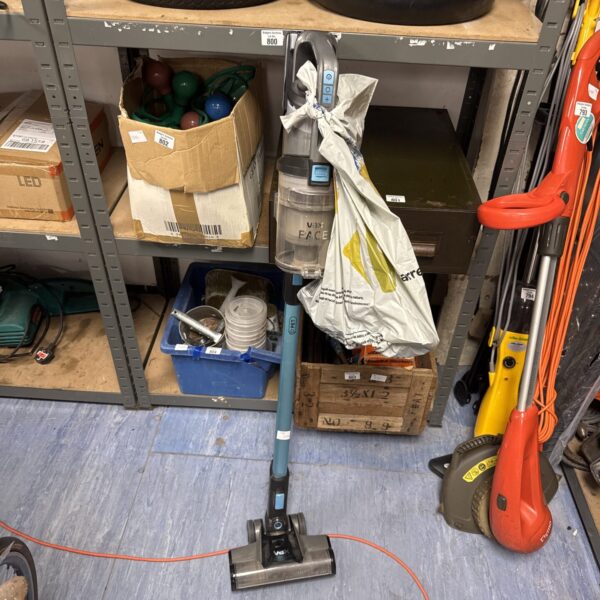 Vax OnePWR cordless vacuum with attachments and charger.