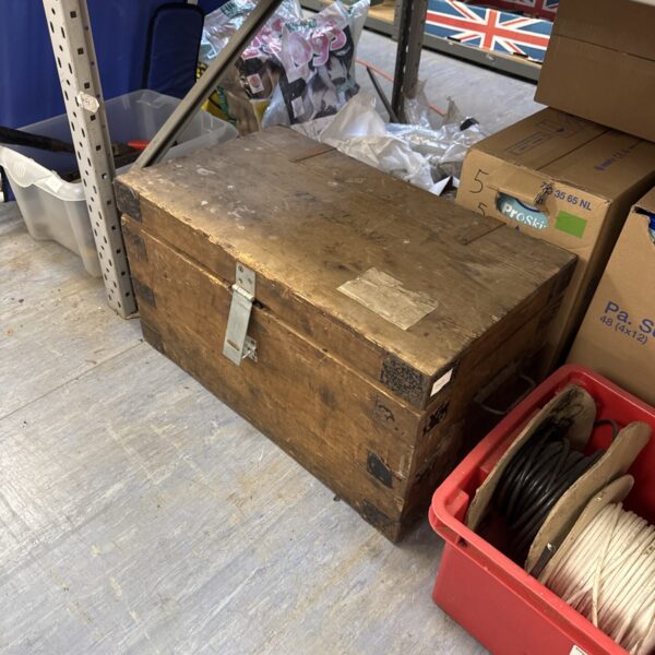 Vintage wooden chest with weathered finish, ideal for storage.