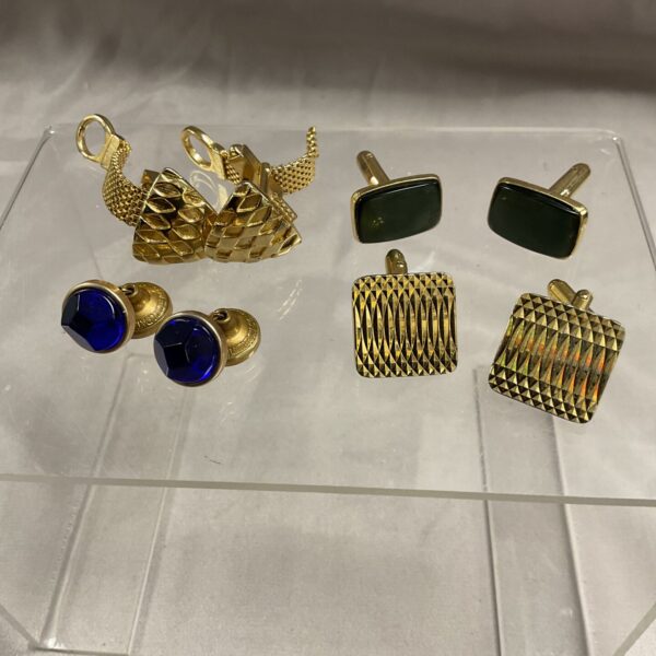Vintage cufflinks lot featuring gold tone designs.