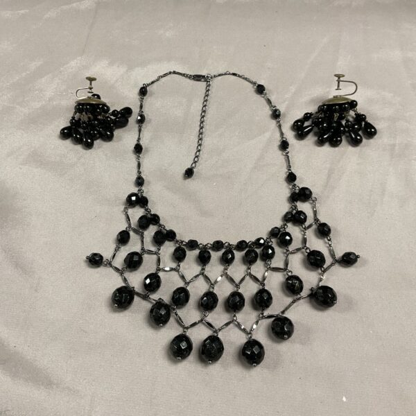 Vintage 1950s jet necklace and earrings set, black faceted beads.