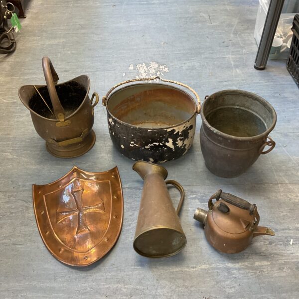 Antique copper and brass lot including shield and coal scuttle.