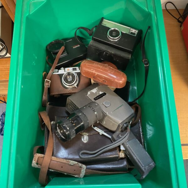 Vintage camera lot including Kodak, Halina and Canon cameras.