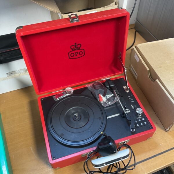 Red GPO portable record player with turntable visible.