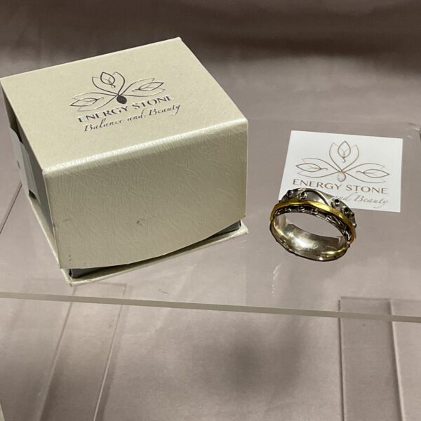 Close-up of sterling silver Radha spinner ring, size W.