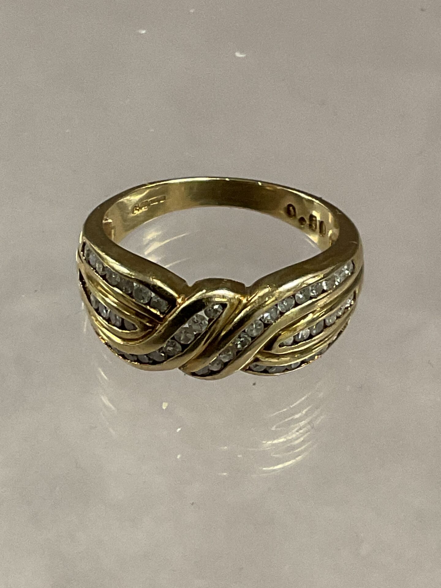 721 9ct Yellow gold and diamond crossover ring size O 4.45g gross