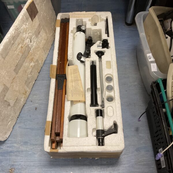 Vintage telescope in its original box with accessories.