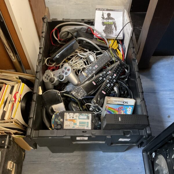 Mixed electronics lot with PSP consoles and PS2 controllers for repair.